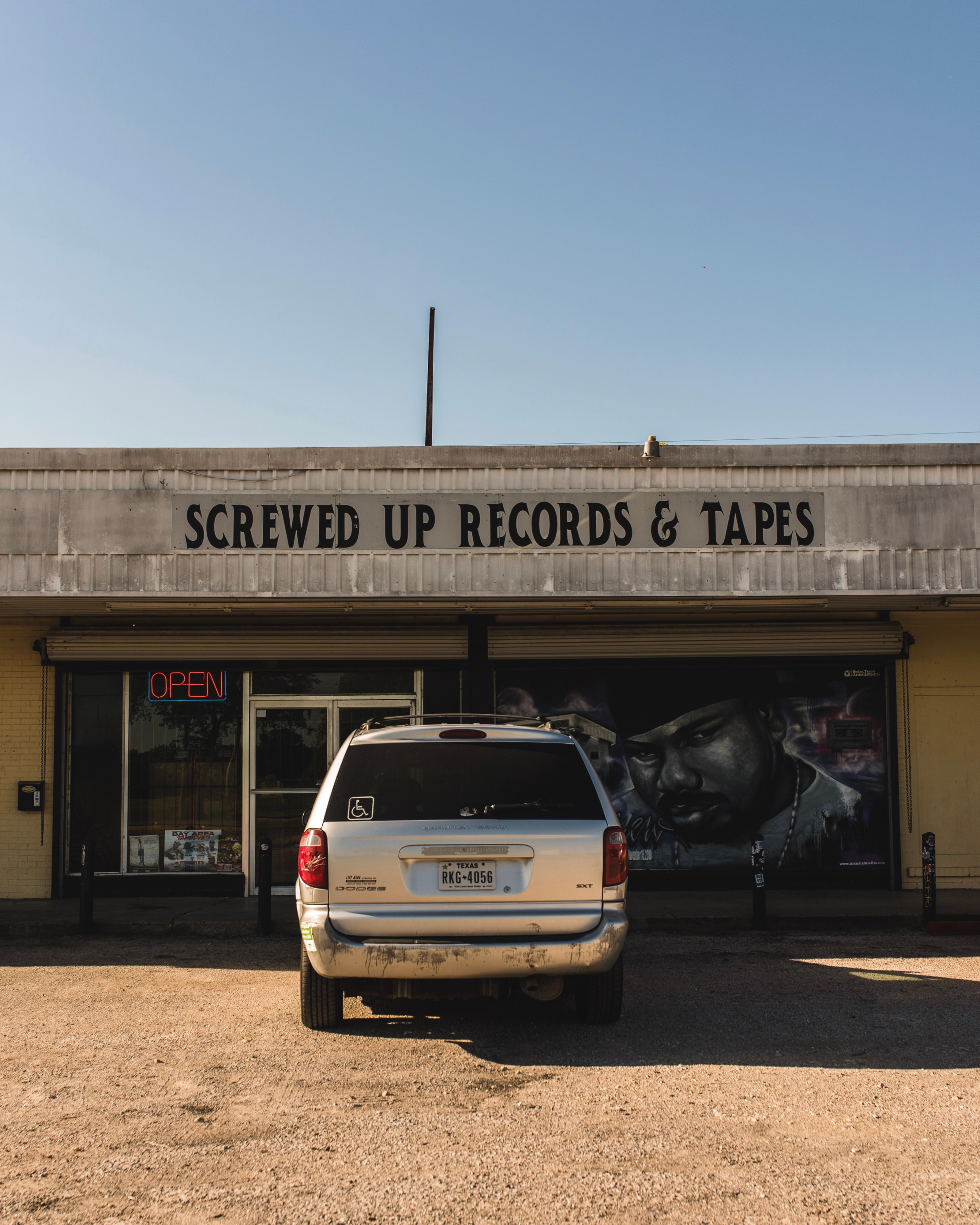 Parking lot photo of DJ Screw's legacy store in Houston "Screwed Up Records & Tapes"