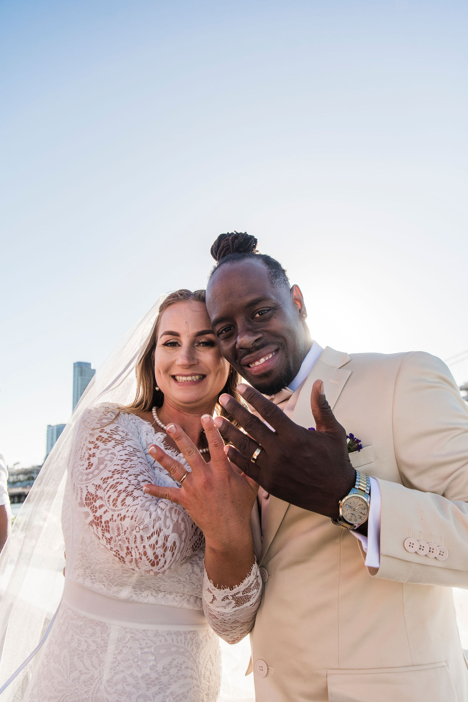 newlywed couple staring into camera